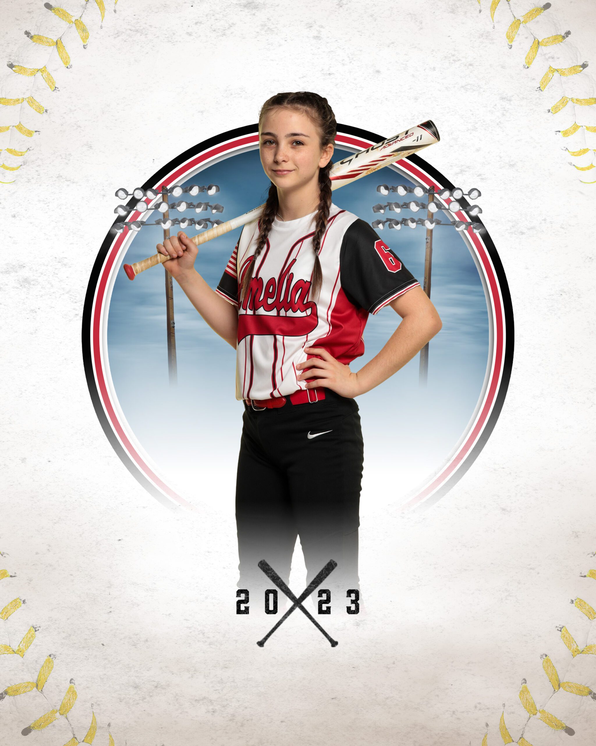 Middle school girl in softball uniform holding a bat over her shoulder