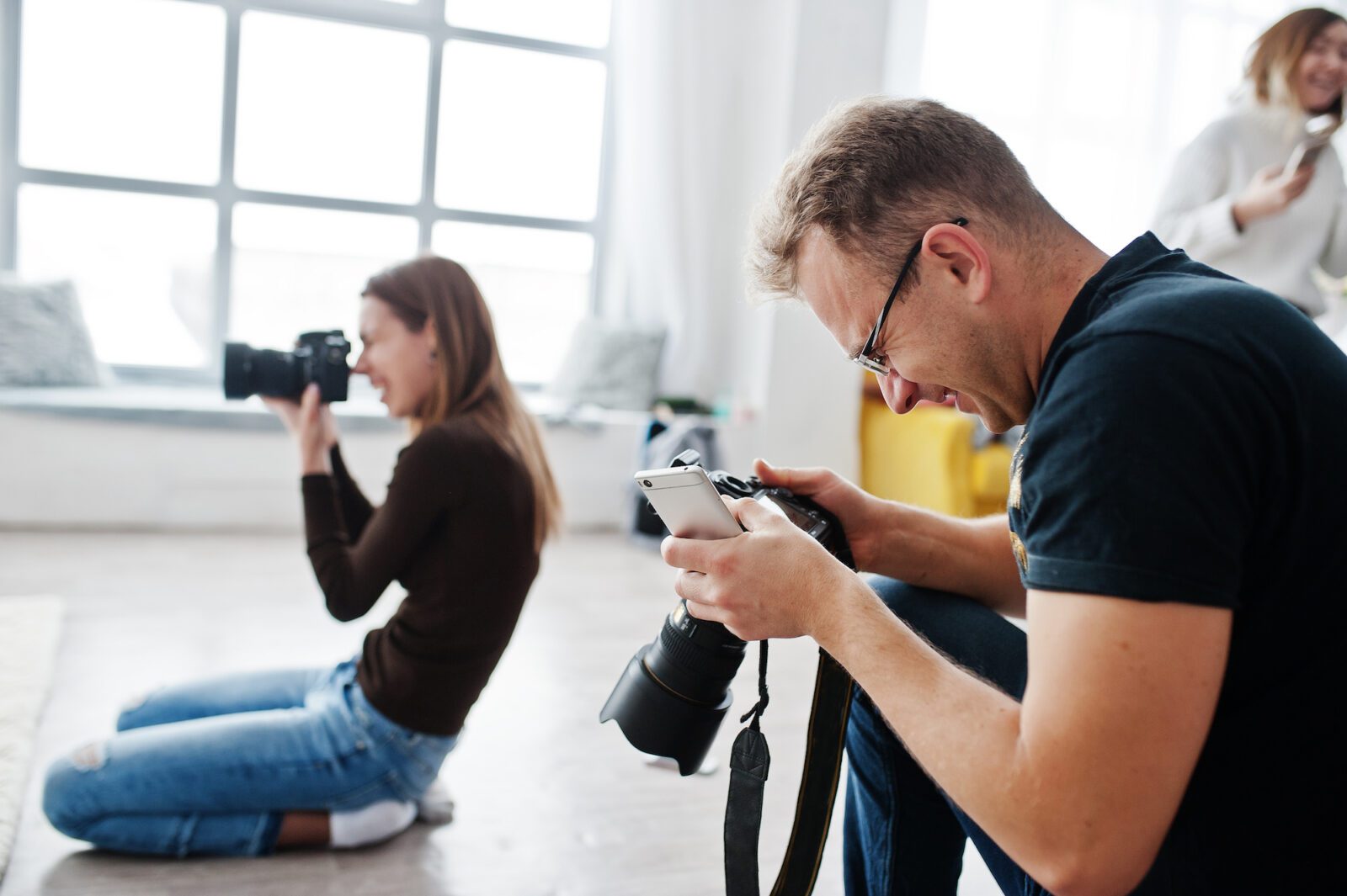 A man focused on taking a photo, representing the journey of making photography a thriving business