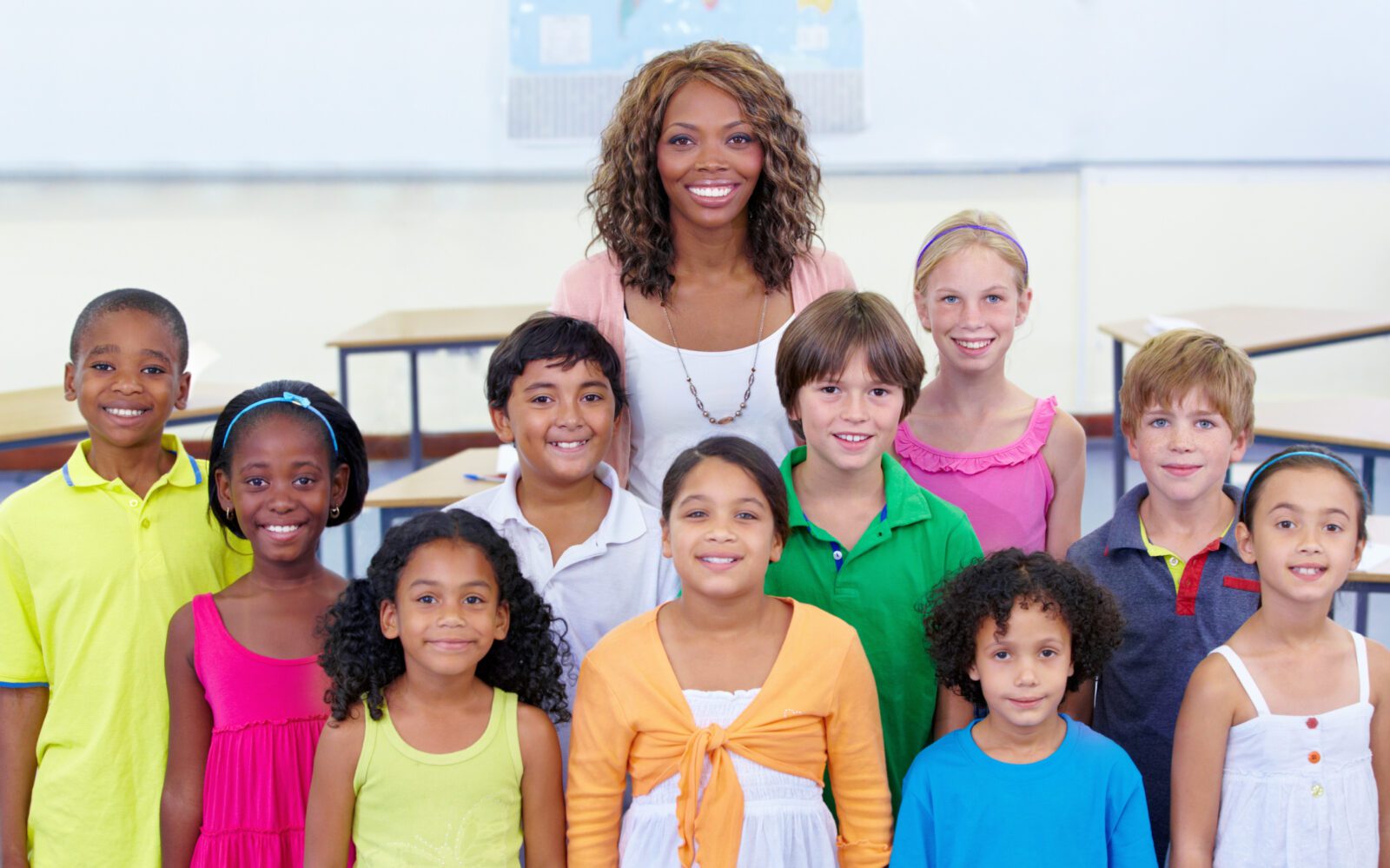 Students and teacher posing for school picture day