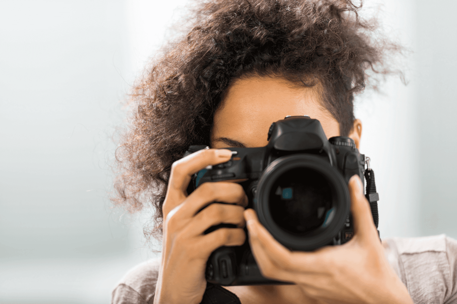 A woman takes a professional photograph