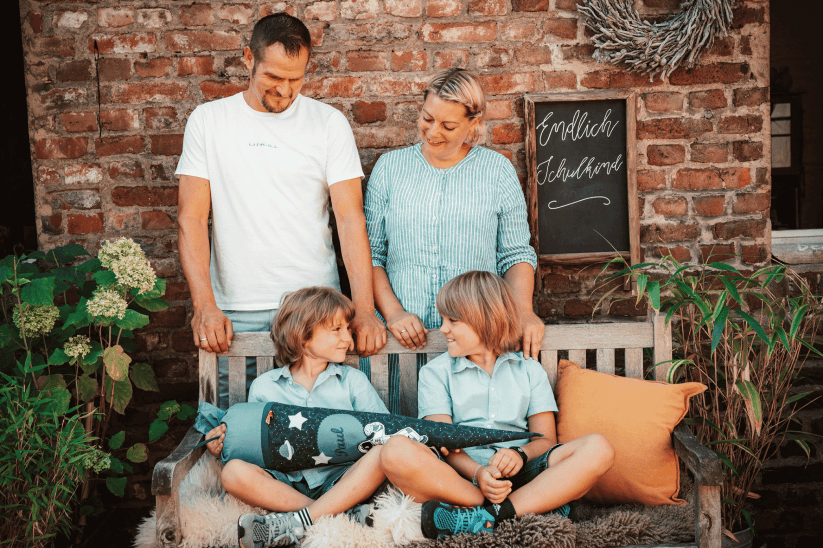 A family poses outside in a classic pose