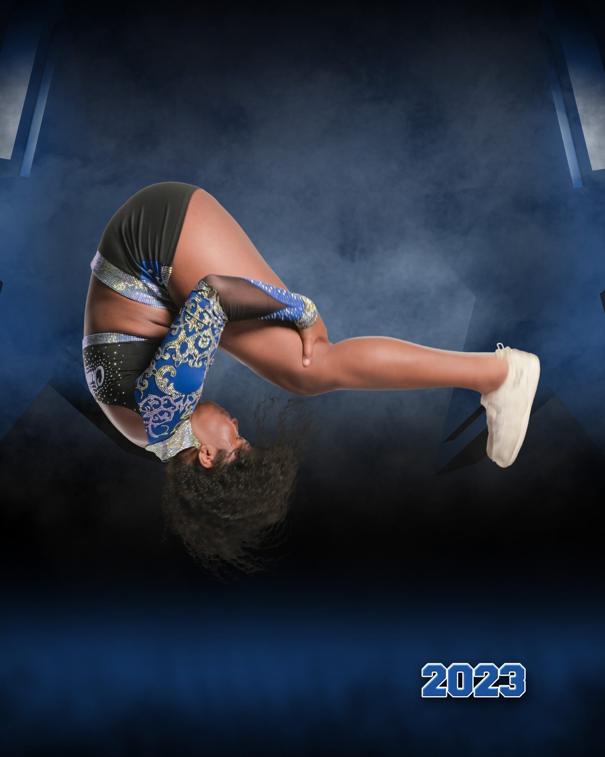 A cheerleader tumbles mid-air